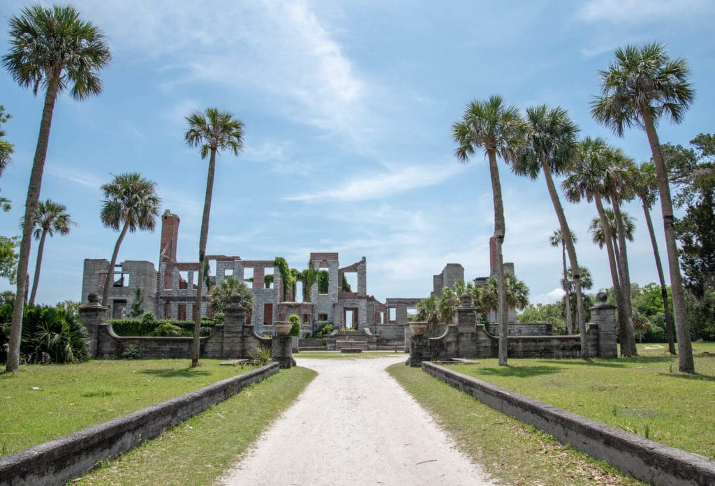 Enjoy a ferry or boat adventure over to Dungeness Beach where you can find rolling sand dunes and plenty of nature. (Above: Dungeness Ruins, Cumberland Island)