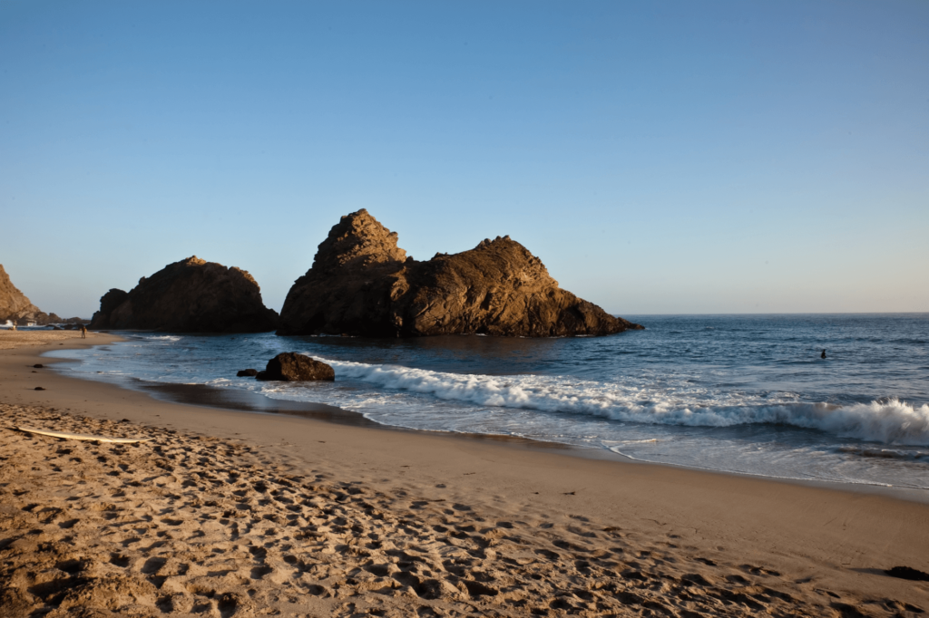 Pfeiffer Beach in Big Sur is known for its purple sand and rugged beauty.