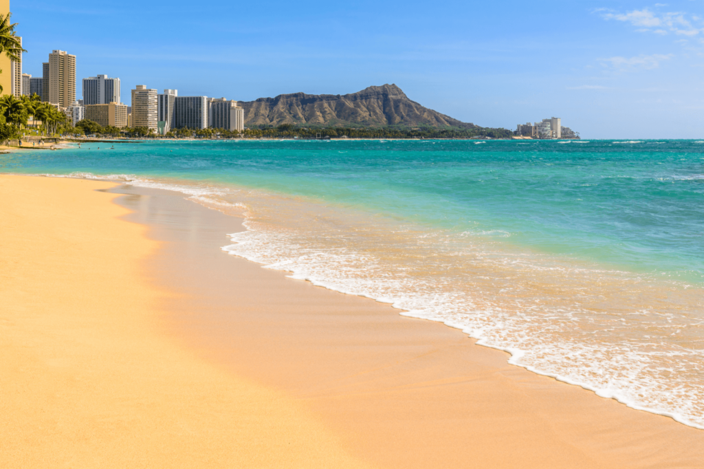 Waikiki Beach is an iconic surfing beach with incredible views of Diamond Head.