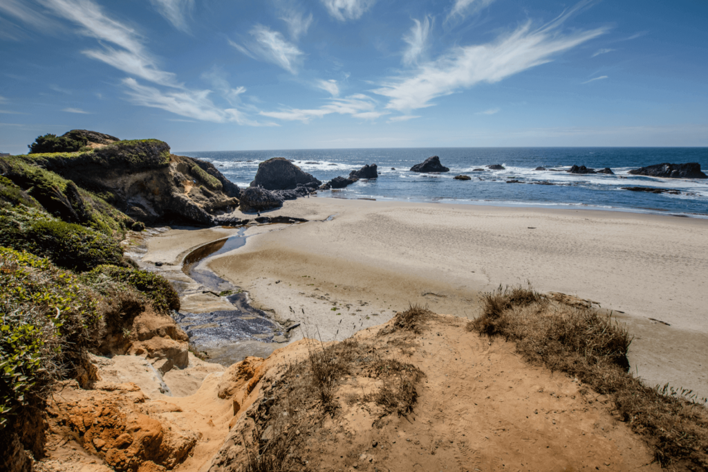 Moolack Beach is known for its ancient driftwood piles and multicolored sea glass shards – a true hidden gem for beachcombers and fossil hunters.