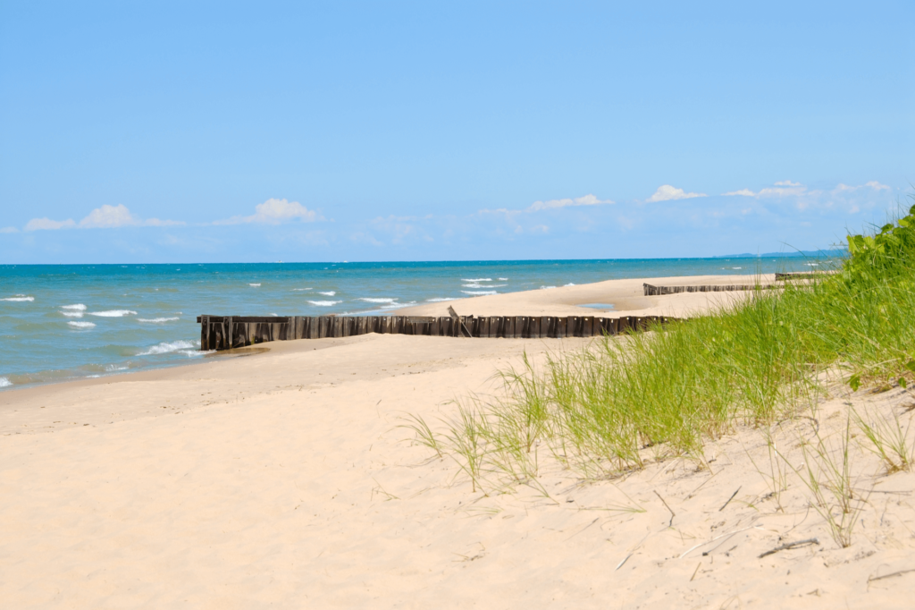 Warren Dunes State Park is known for its beach which boasts tall rolling sand dunes and white sands.