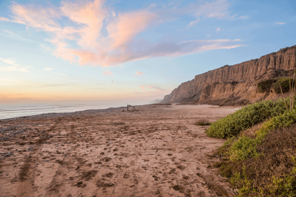 One of the most beautiful Southern California beaches is the San Onofre State Beach in San Clemente, an hour’s drive north of San Diego.