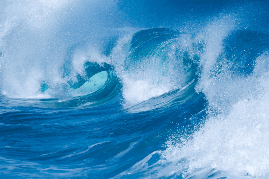Four basic types of wave breaks: spilling breakers, plunging breakers, surging breakers, and collapsing breakers.