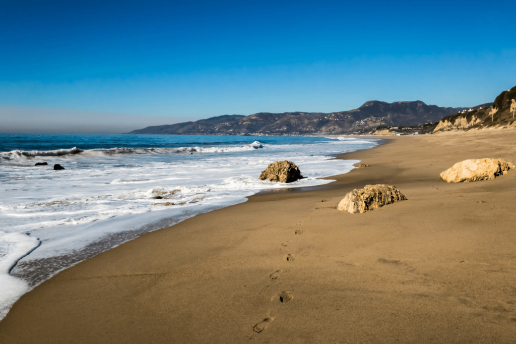 Zuma Beach is the ideal family-friendly destination, with gentle waters surrounded by California hills.