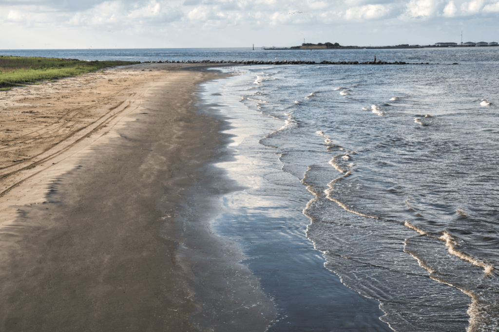 Grand Isle Beach is a peaceful destination off the beaten path that attracts anglers, birdwatchers, and beachgoers looking to relax.